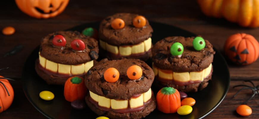 Delicious,Desserts,Decorated,As,Monsters,On,Wooden,Table.,Halloween,Treat